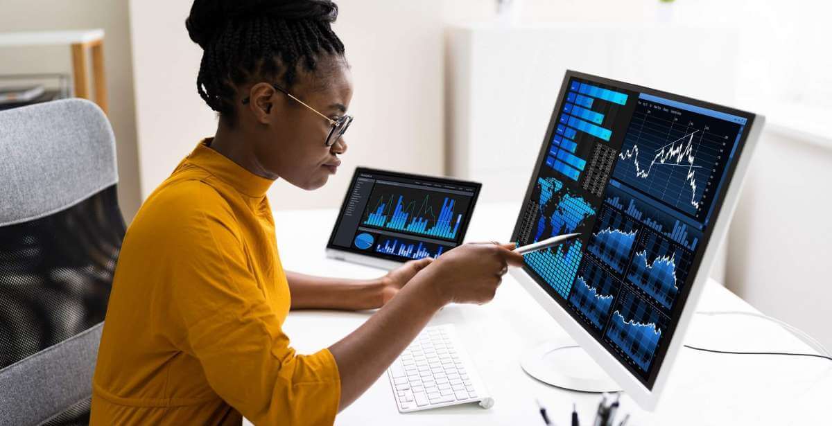 Data Analyst reviewing reports